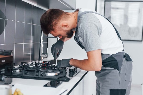 young-professional-plumber-in-grey-uniform-working-resize.jpg young-professional-plumber-in-grey-uniform-working-resize.jpg